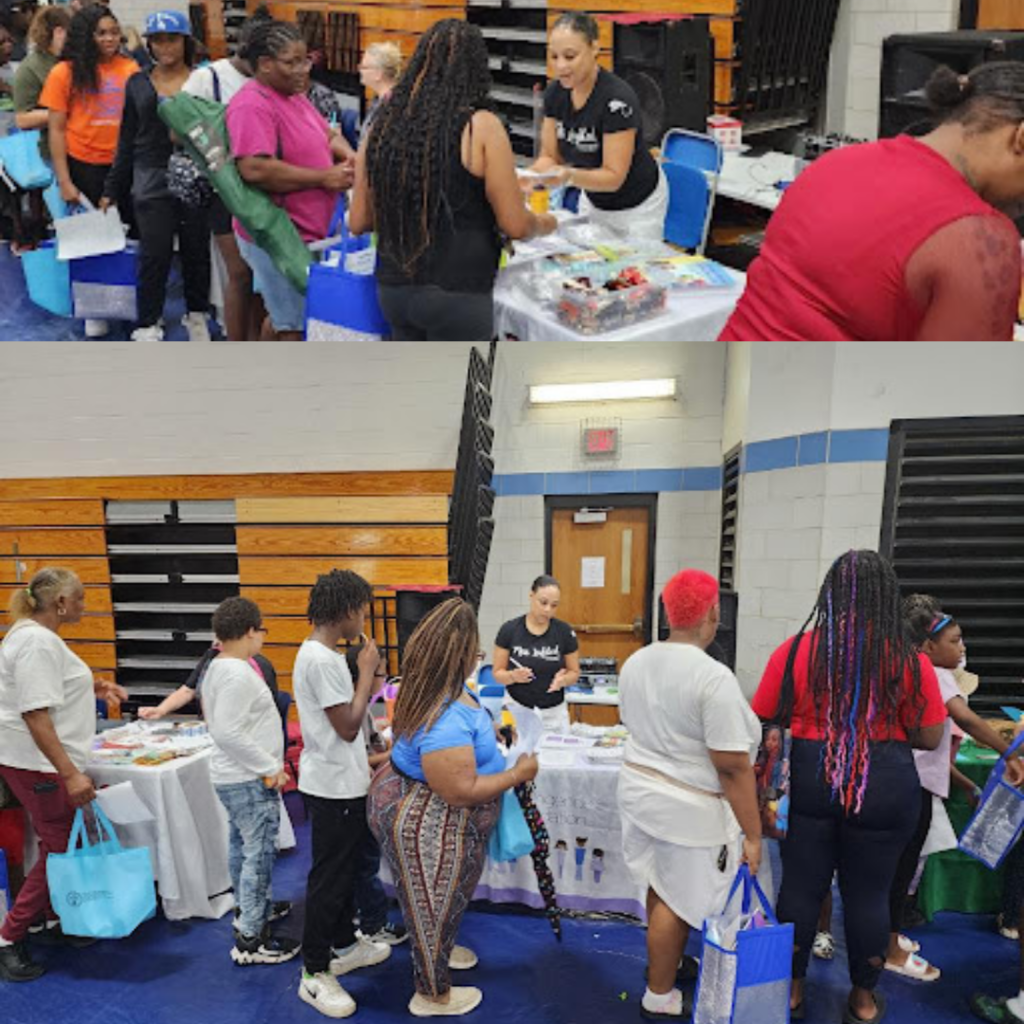 amber clayborne staffing the kerengende table at the jackie joyner kersee center