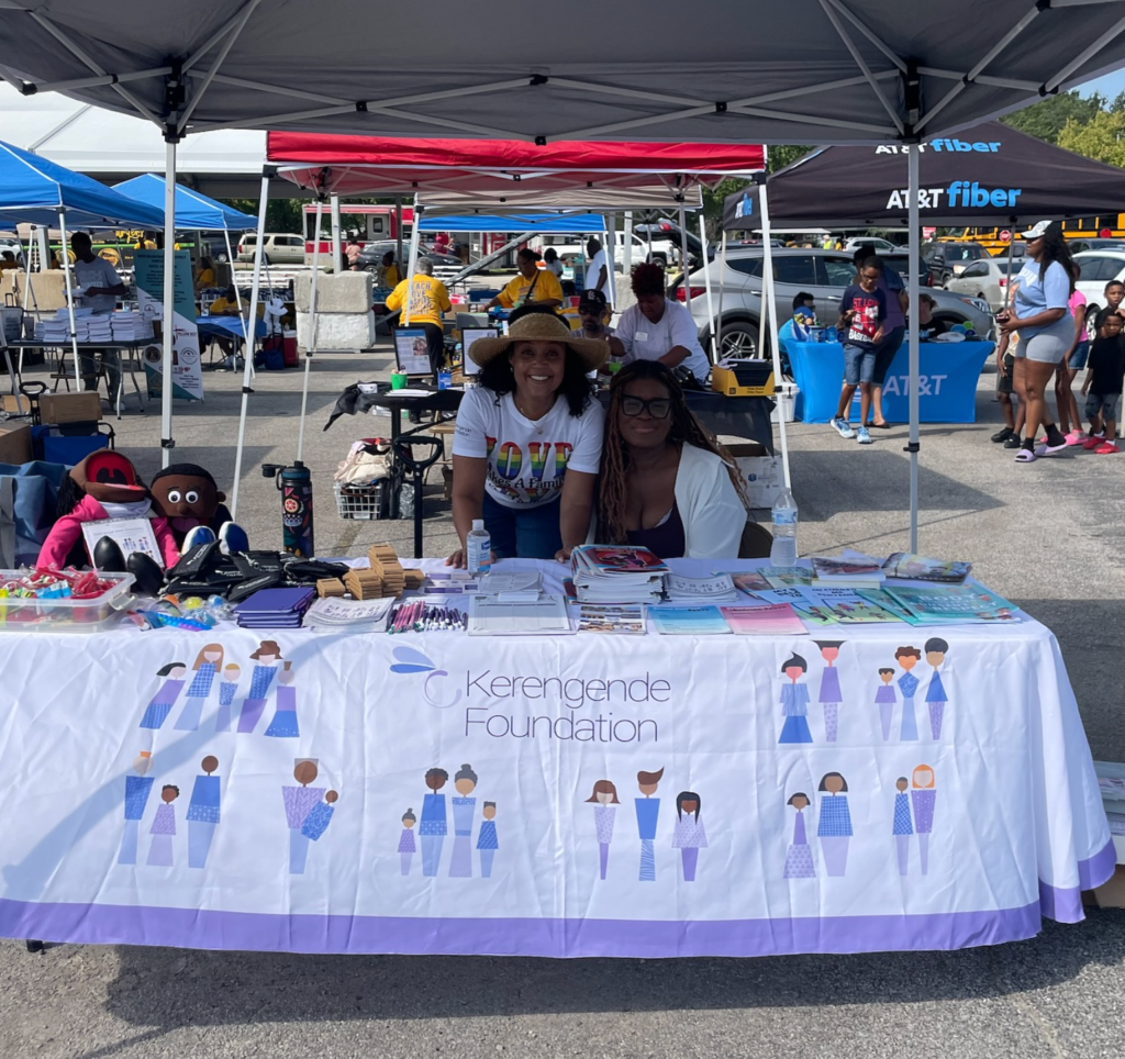 amber clayborne and a staff member tabling at the metro east pride  event in bellville, IL. 